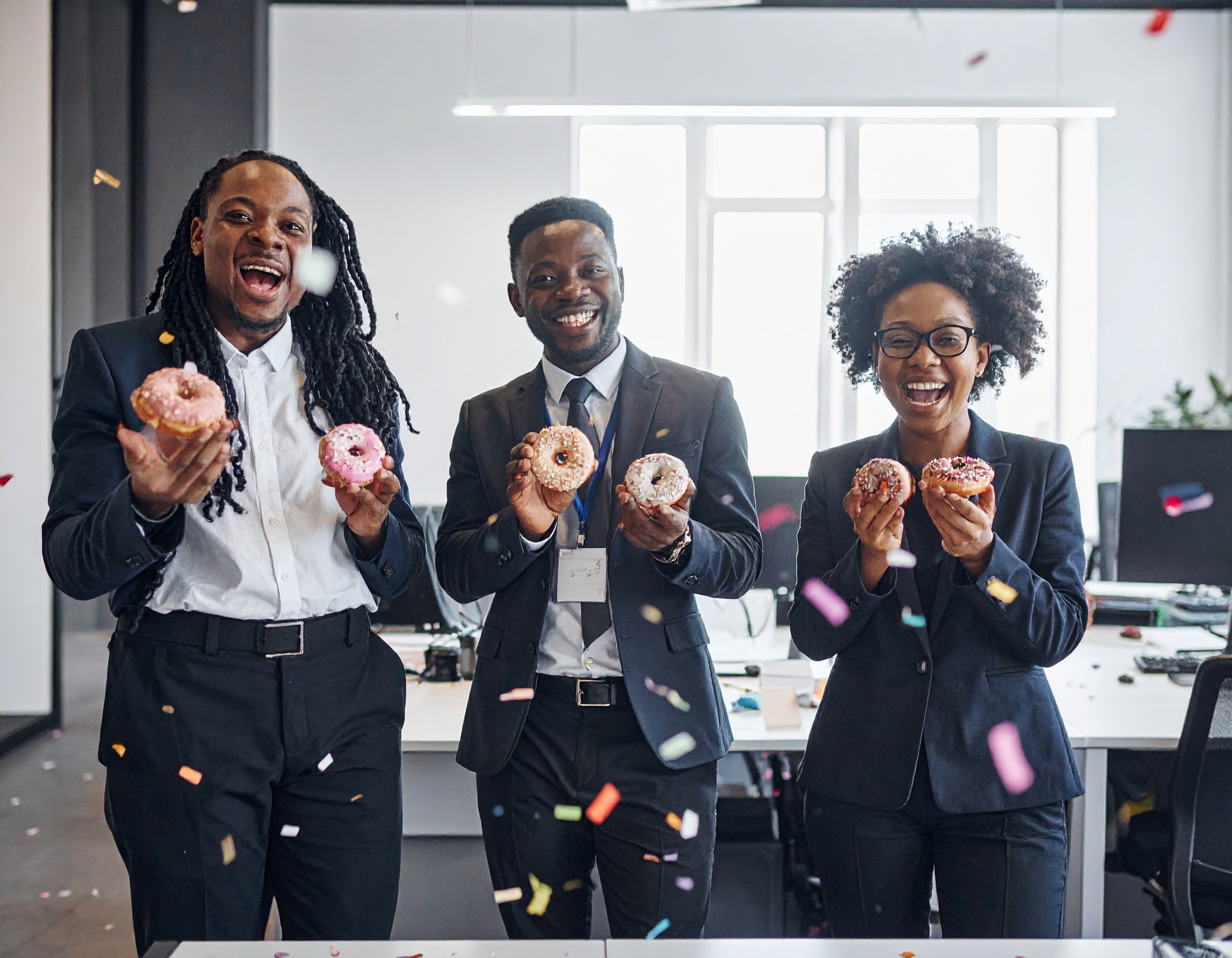 Team celebrating with doughnuts